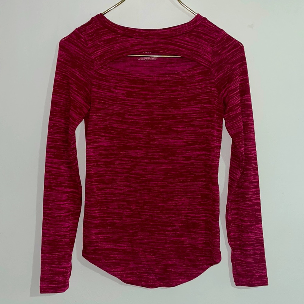 Juicy couture long sleeve pink top with slit cut out detail. Size x small.
